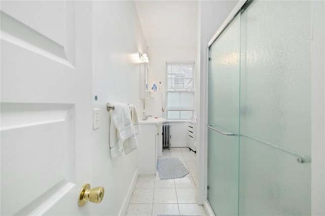full bath with tile patterned floors, a shower stall, vanity, radiator heating unit, and baseboards