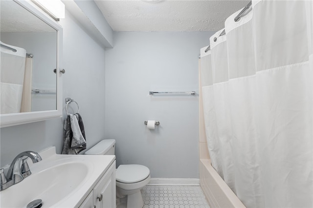 full bathroom featuring a textured ceiling, toilet, tile patterned floors, vanity, and shower / tub combo with curtain