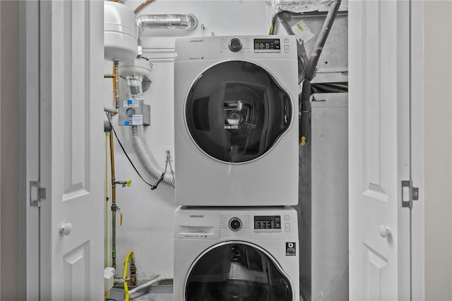 laundry area featuring stacked washer and clothes dryer