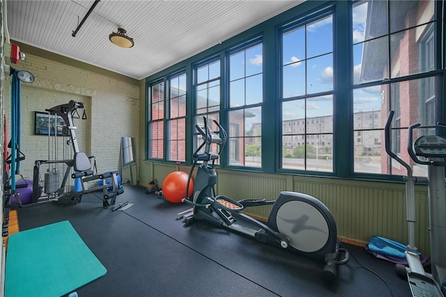 workout area with brick wall