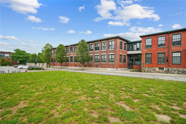 view of property's community with a yard