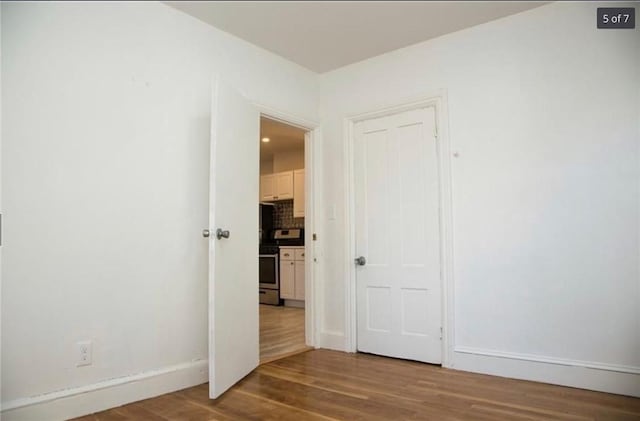 87 Oakland Ave, Providence, RI 02908 - empty room featuring wood finished floors and baseboards