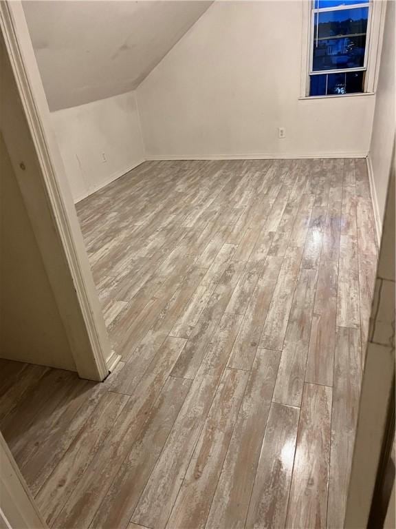 87 Oakland Ave, Providence, RI 02908 - additional living space with hardwood / wood-style flooring, vaulted ceiling, and baseboards