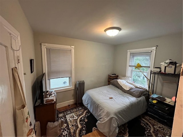 87 Oakland Ave, Providence, RI 02908 - bedroom with radiator heating unit and wood finished floors