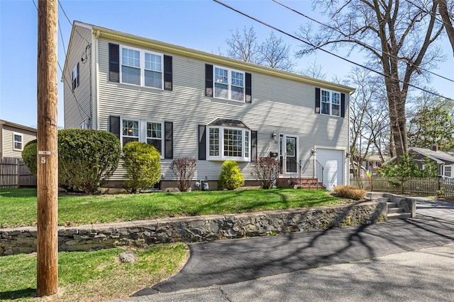 50 Harold St, East Providence, RI 02915 - colonial house featuring an attached garage and driveway