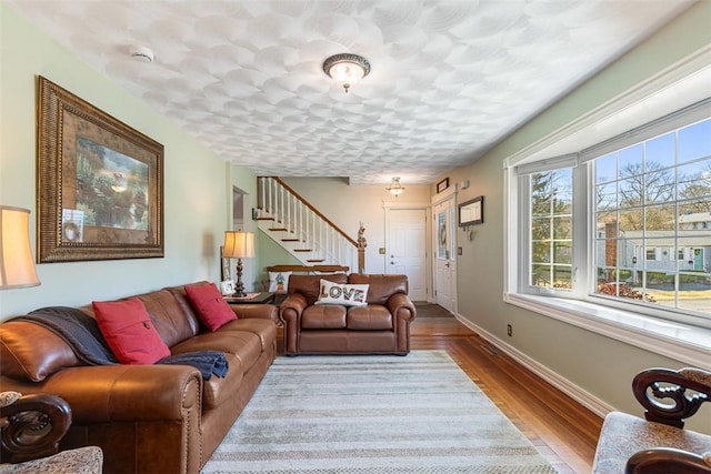 50 Harold St, East Providence, RI 02915 - living area featuring stairway, wood finished floors, and baseboards