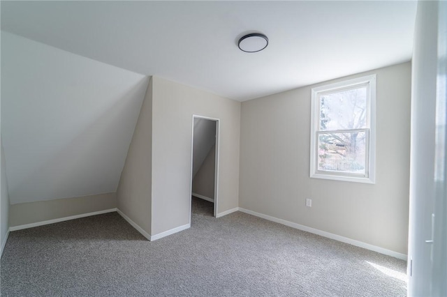 unfurnished bedroom featuring carpet floors and baseboards
