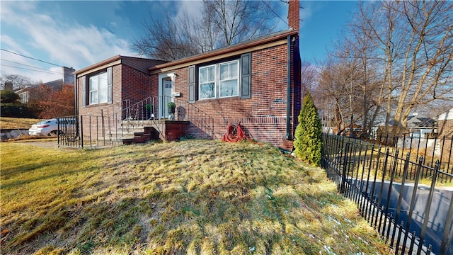 view of front of property with brick siding and a chimney