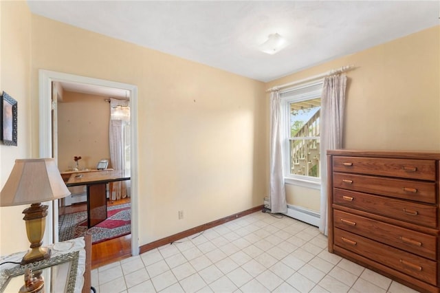 unfurnished room with baseboards and baseboard heating