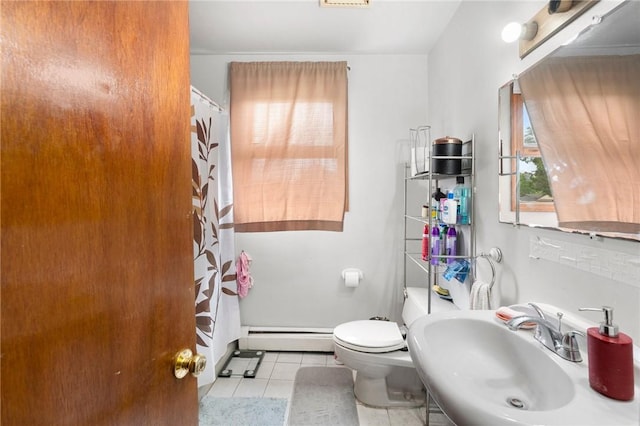 full bath featuring a baseboard heating unit, a sink, tile patterned floors, toilet, and a shower with curtain