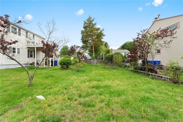 view of yard featuring a wooden deck
