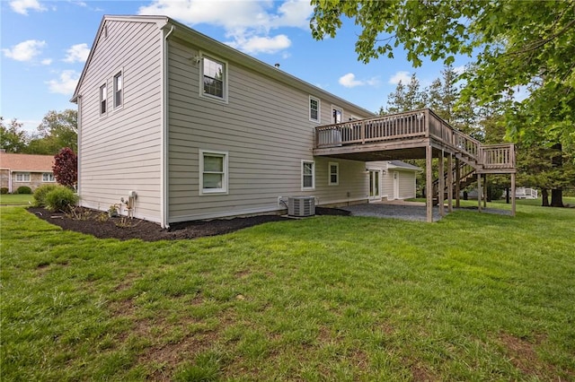 rear view of property with central AC, a wooden deck, a lawn, a patio area, and stairs