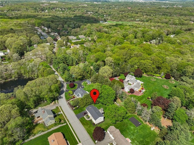aerial overview of property's location with a forest