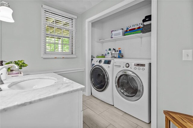 laundry area featuring a sink and independent washer and dryer