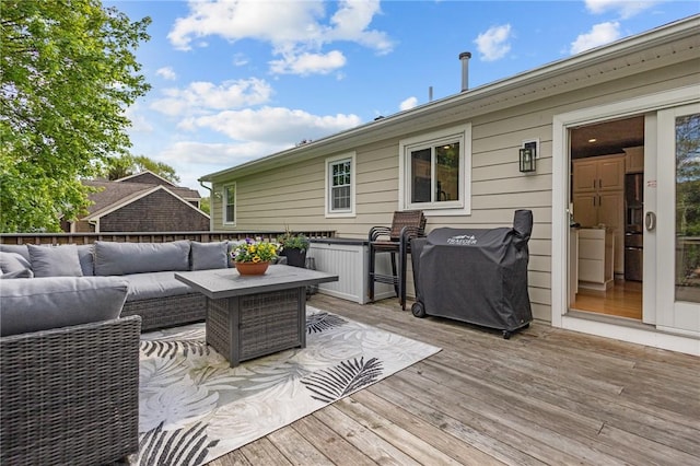 deck featuring outdoor lounge area and area for grilling