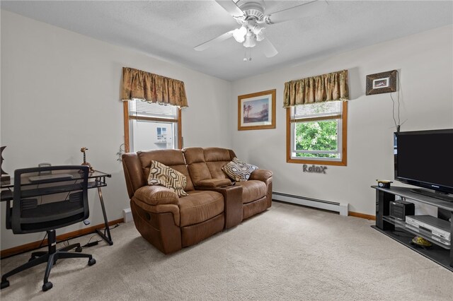 13 Parker Ave, Warren, RI 02885 - living room with baseboard heating, plenty of natural light, carpet floors, and an office area