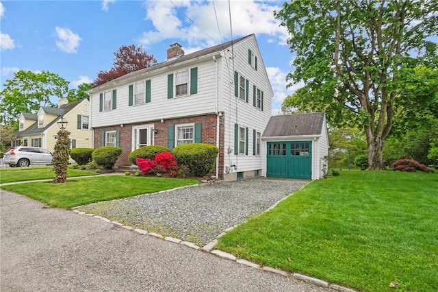 57 Sylvan Rd, East Providence, RI 02916 - colonial house with a chimney, brick siding, and a front yard