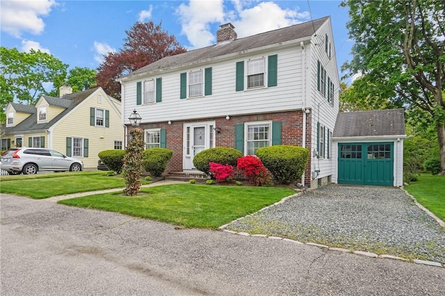 57 Sylvan Rd, East Providence, RI 02916 - colonial home featuring a chimney, a front yard, and brick siding