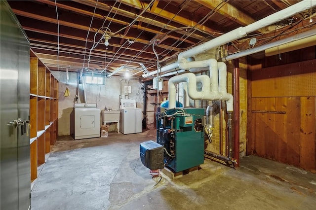 57 Sylvan Rd, East Providence, RI 02916 - below grade area with separate washer and dryer, a sink, and a heating unit