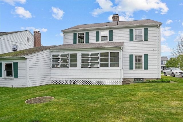 57 Sylvan Rd, East Providence, RI 02916 - back of house featuring a yard and a chimney
