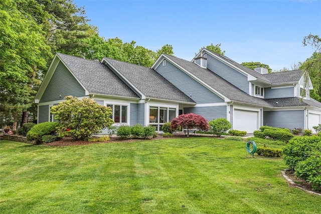 26 Bagy Wrinkle Cv, Warren, RI 02885 - traditional-style house featuring a garage, a front lawn, and a shingled roof