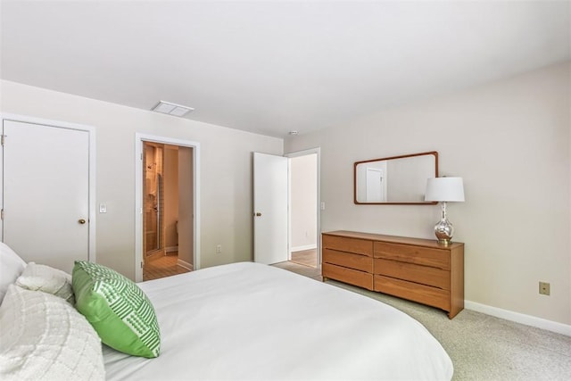 26 Bagy Wrinkle Cv, Warren, RI 02885 - bedroom with light colored carpet, baseboards, and ensuite bathroom
