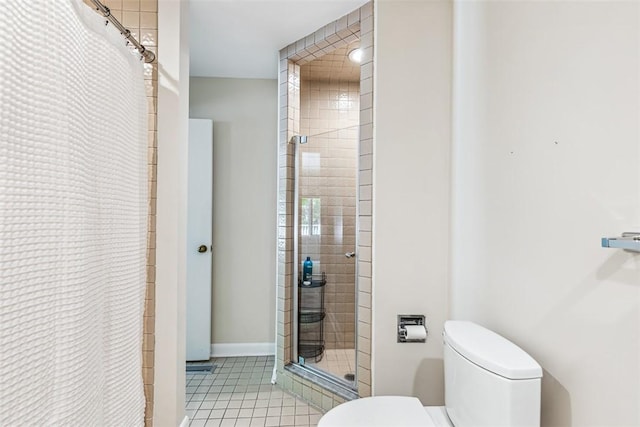 26 Bagy Wrinkle Cv, Warren, RI 02885 - bathroom featuring a stall shower, toilet, and tile patterned floors
