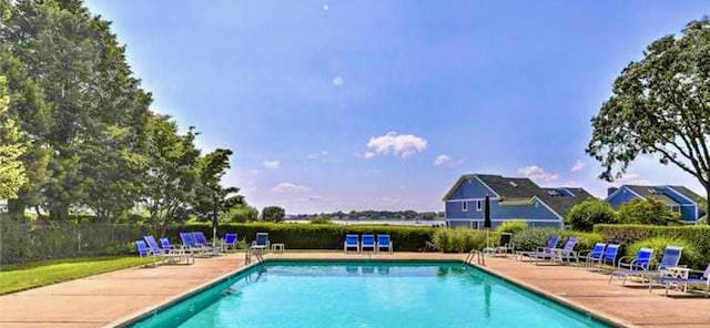 26 Bagy Wrinkle Cv, Warren, RI 02885 - community pool with a patio area and fence