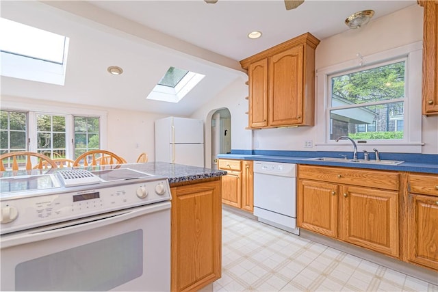 43 Standish Rd, Jamestown, RI 02835 - kitchen featuring white appliances, a skylight, a sink, light floors, and lofted ceiling
