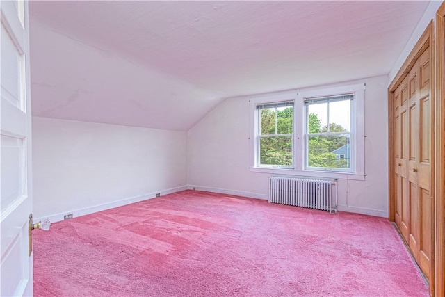 43 Standish Rd, Jamestown, RI 02835 - additional living space with radiator, vaulted ceiling, light colored carpet, and baseboards