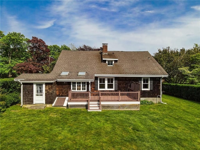 43 Standish Rd, Jamestown, RI 02835 - rear view of house with a wooden deck, a yard, a chimney, and a shingled roof