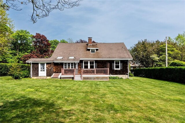 43 Standish Rd, Jamestown, RI 02835 - back of house featuring a wooden deck, a yard, and a chimney