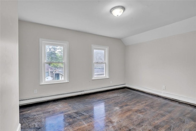additional living space with wood finished floors, plenty of natural light, a baseboard radiator, lofted ceiling, and baseboards