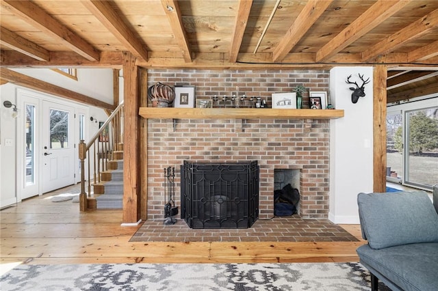 40 Charlotte Ave, North Kingstown, RI 02874 - living room with wood ceiling, beamed ceiling, hardwood / wood-style flooring, baseboards, and stairway