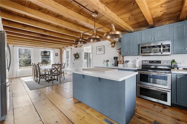 40 Charlotte Ave, North Kingstown, RI 02874 - kitchen featuring stainless steel appliances, wood ceiling, beam ceiling, light countertops, and light wood finished floors