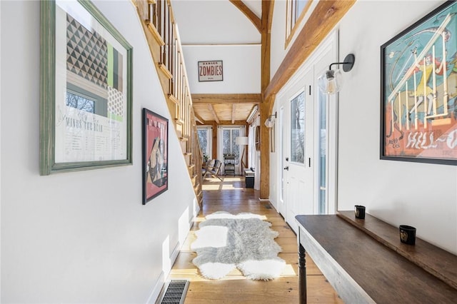 40 Charlotte Ave, North Kingstown, RI 02874 - corridor with wood finished floors, healthy amount of natural light, stairway, and beam ceiling