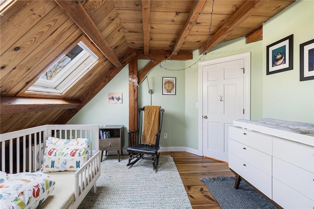 40 Charlotte Ave, North Kingstown, RI 02874 - bedroom featuring a skylight, wood finished floors, wooden ceiling, and baseboards