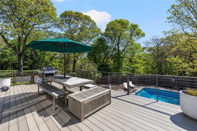 40 Charlotte Ave, North Kingstown, RI 02874 - wooden deck with grilling area, outdoor dining space, and view of wooded area