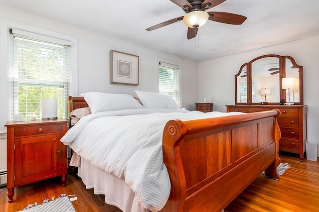 bedroom featuring dark wood-style floors and ceiling fan