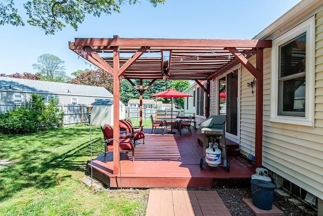 wooden terrace featuring outdoor dining area, area for grilling, an outdoor structure, a storage unit, and a pergola