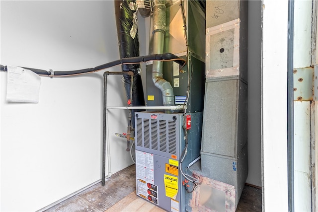 utility room featuring heating unit