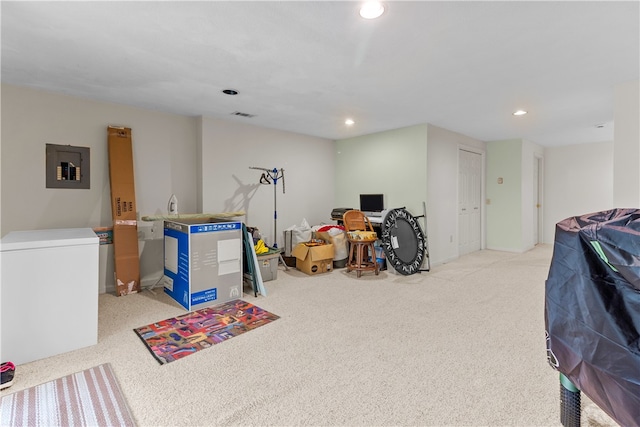 playroom with carpet floors, recessed lighting, and electric panel
