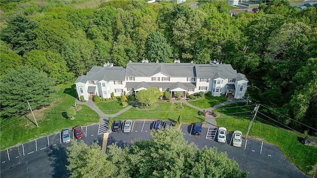 aerial view of property's location featuring a heavily wooded area