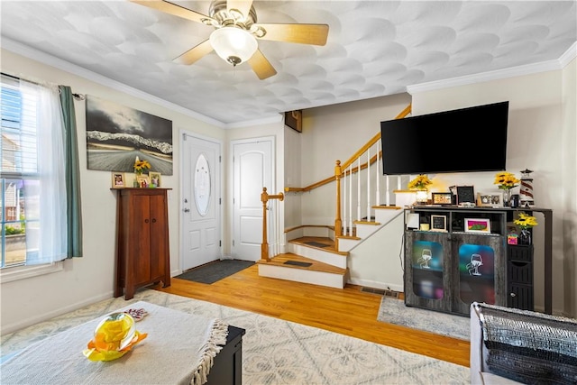 151 Bend St S Unit 2, Pawtucket, RI 02860 - entrance foyer featuring stairs, wood finished floors, ceiling fan, baseboards, and crown molding