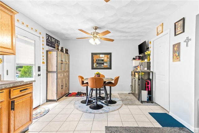 151 Bend St S Unit 2, Pawtucket, RI 02860 - dining space with a ceiling fan, light tile patterned floors, and baseboards