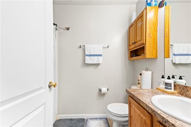 151 Bend St S Unit 2, Pawtucket, RI 02860 - bathroom with vanity, toilet, and baseboards