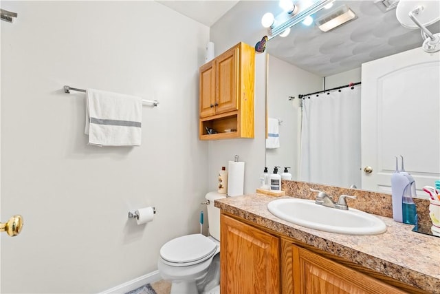 151 Bend St S Unit 2, Pawtucket, RI 02860 - bathroom featuring toilet, vanity, a shower with curtain, and baseboards