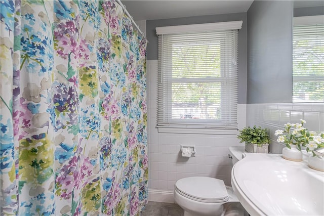33 Perennial Dr, Cranston, RI 02920 - full bath with tile walls, plenty of natural light, toilet, a sink, and a shower with curtain