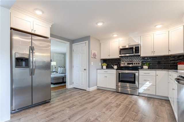 33 Perennial Dr, Cranston, RI 02920 - kitchen featuring stainless steel appliances, white cabinets, light wood-style floors, and backsplash