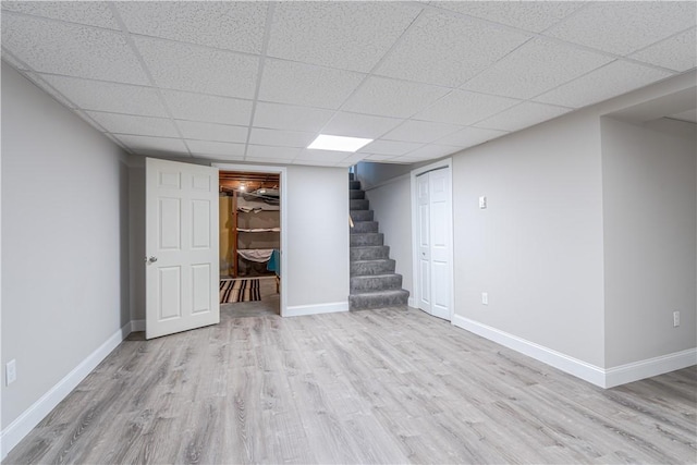 33 Perennial Dr, Cranston, RI 02920 - finished below grade area with wood finished floors, stairway, baseboards, and a drop ceiling